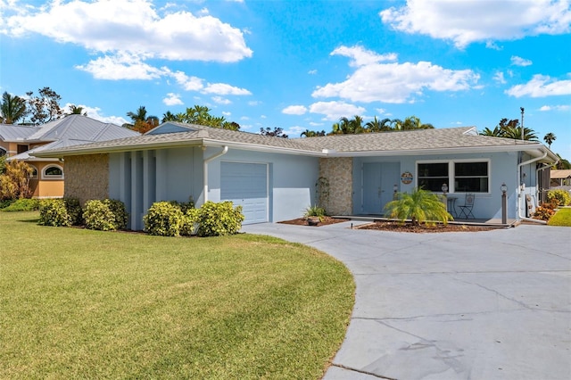 ranch-style home with a garage and a front lawn