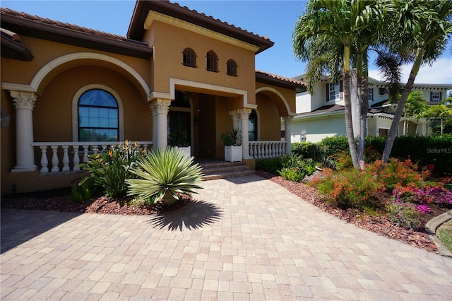 mediterranean / spanish-style home featuring a porch