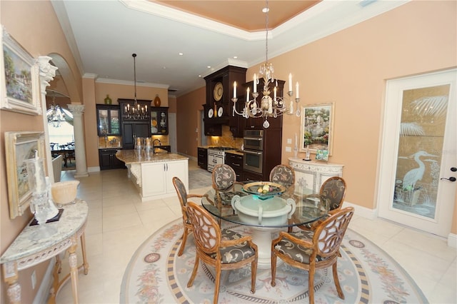 tiled dining room with a chandelier, crown molding, and sink