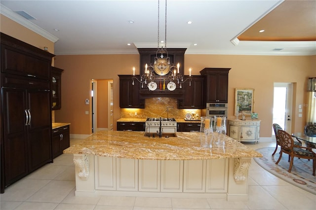 3507 Terin Ct, Punta Gorda, FL 33950 - kitchen with light tile patterned floors, decorative backsplash, dark brown cabinetry, a chandelier, and light stone countertops