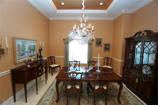 dining area featuring a raised ceiling, crown molding, and a notable chandelier