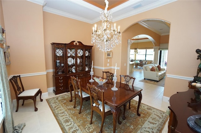 tiled dining room with crown molding and a chandelier