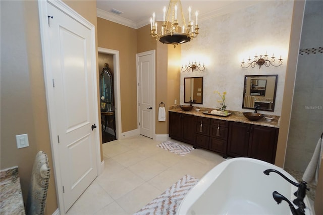 bathroom with tile patterned floors, a washtub, vanity, crown molding, and a notable chandelier