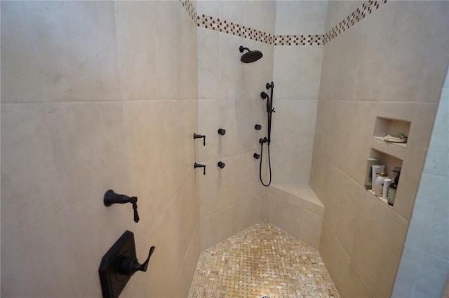 bathroom with tiled shower