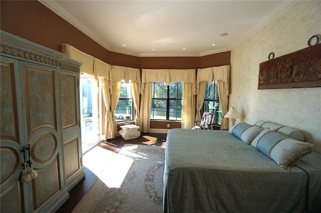 bedroom featuring ornamental molding and hardwood / wood-style flooring