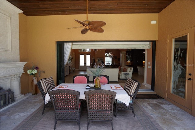 dining area featuring ceiling fan, lofted ceiling, and wood ceiling