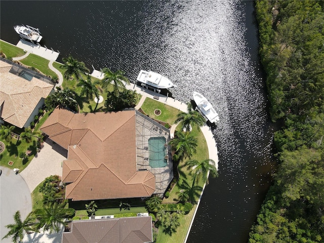 birds eye view of property with a water view