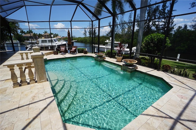 view of pool featuring a lanai, a patio area, and a water view