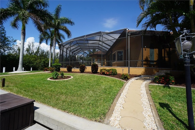 view of yard with glass enclosure