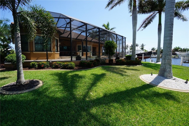 3507 Terin Ct, Punta Gorda, FL 33950 - view of green lawn featuring glass enclosure and a water view