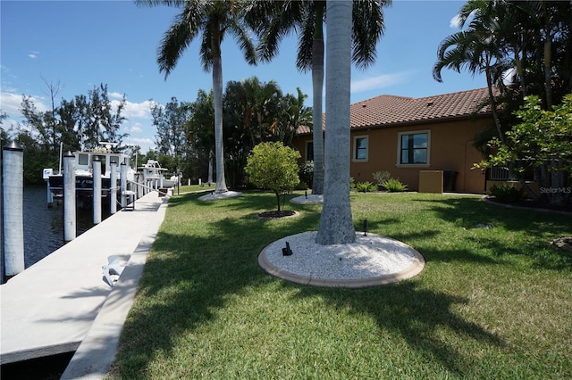 view of yard with a boat dock