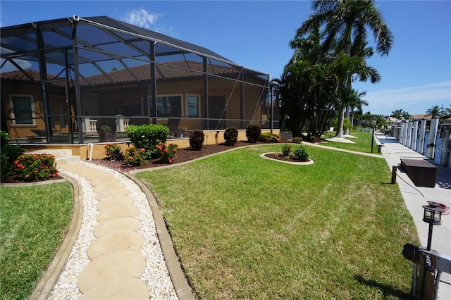 view of yard with glass enclosure