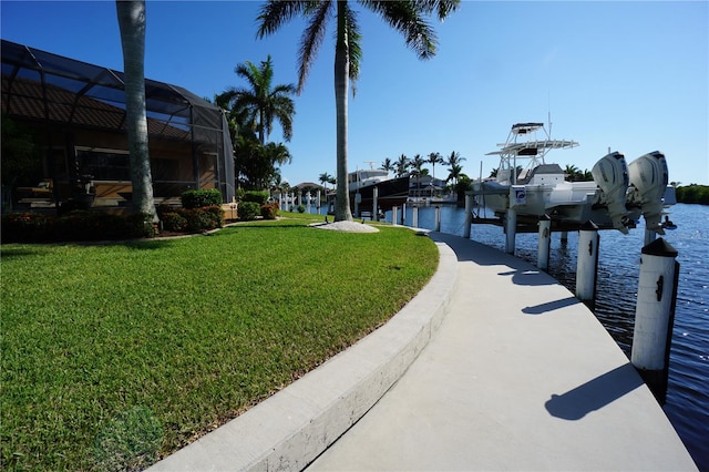 view of dock featuring a water view and a lawn