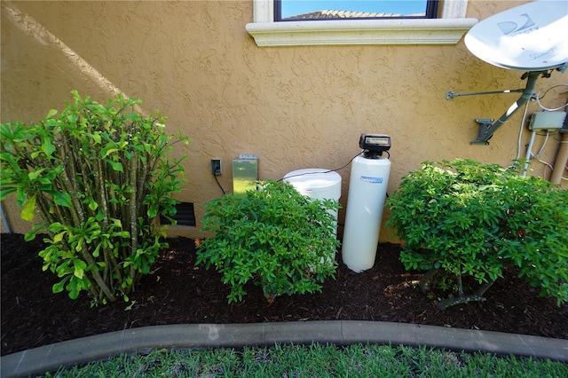 3507 Terin Ct, Punta Gorda, FL 33950 - exterior view of stucco siding and a water softener