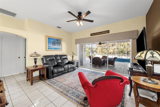 living room with ceiling fan and light tile patterned flooring