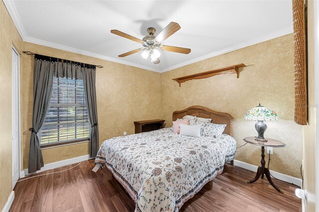 bedroom featuring ceiling fan, crown molding, and wood-type flooring