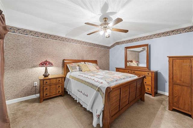 carpeted bedroom featuring ceiling fan and crown molding