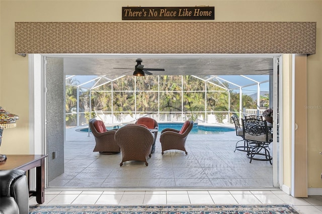 view of patio featuring glass enclosure