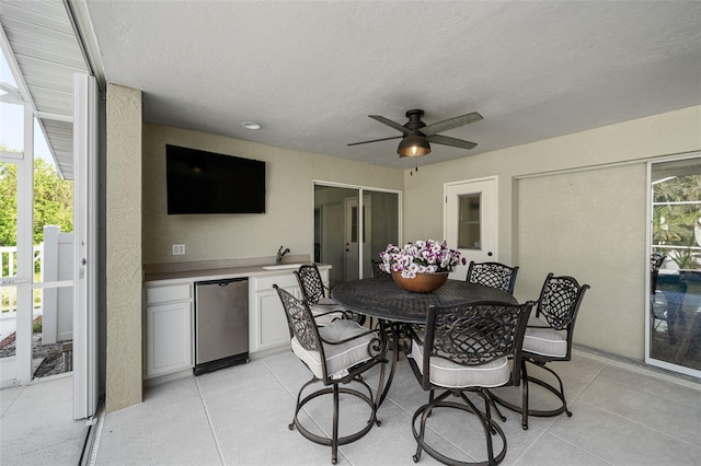 view of patio with ceiling fan and exterior kitchen