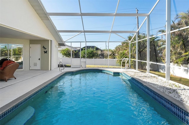 view of swimming pool with a lanai and a patio area