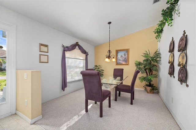 carpeted dining area with a notable chandelier