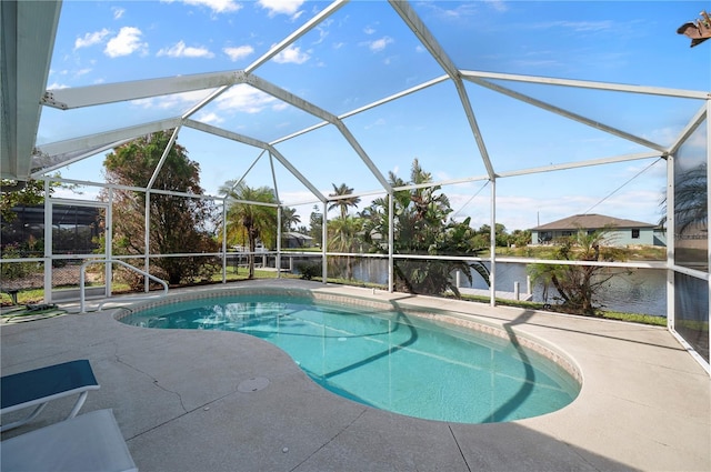 view of swimming pool featuring glass enclosure, a water view, and a patio