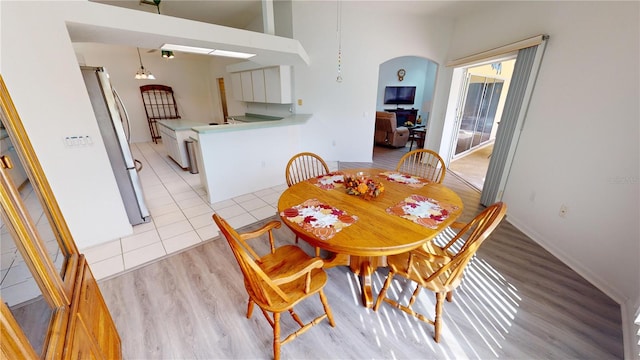 dining area with light hardwood / wood-style floors