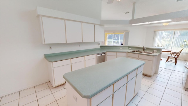 kitchen with white cabinetry and a center island