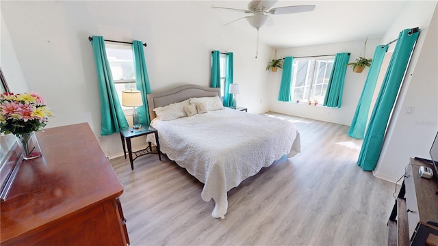 bedroom featuring light hardwood / wood-style flooring and ceiling fan