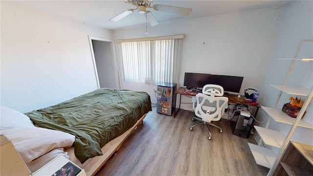 bedroom with ceiling fan and light hardwood / wood-style flooring