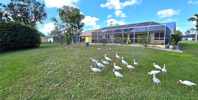 view of yard with a lanai