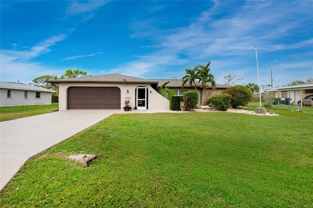 single story home featuring a garage and a front yard