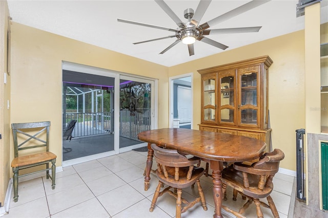 tiled dining room with ceiling fan