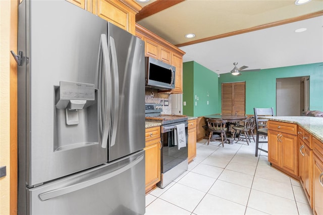 kitchen with light tile patterned flooring, light stone counters, appliances with stainless steel finishes, tasteful backsplash, and ceiling fan