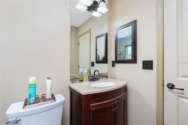 bathroom with toilet and vanity