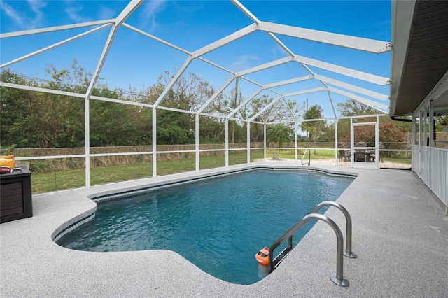 view of swimming pool featuring a patio and a lanai