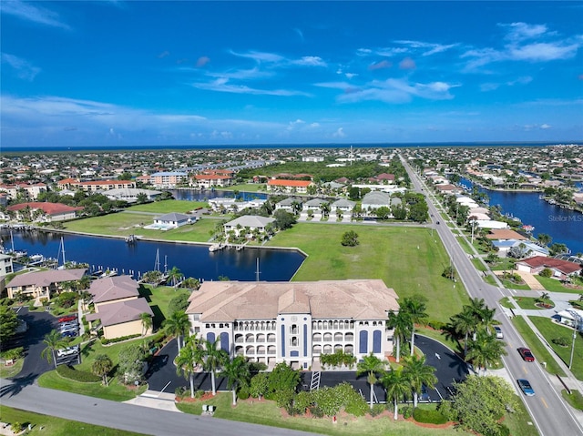 drone / aerial view with a water view