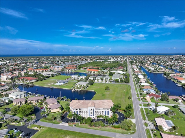 bird's eye view with a residential view and a water view