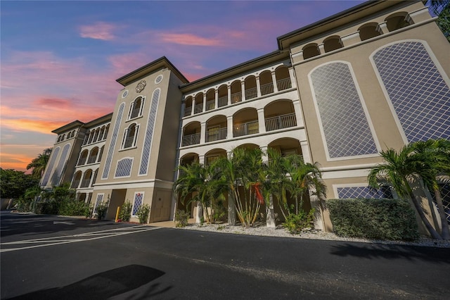 view of outdoor building at dusk