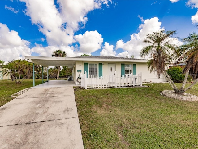 view of front of property with a carport and a front yard