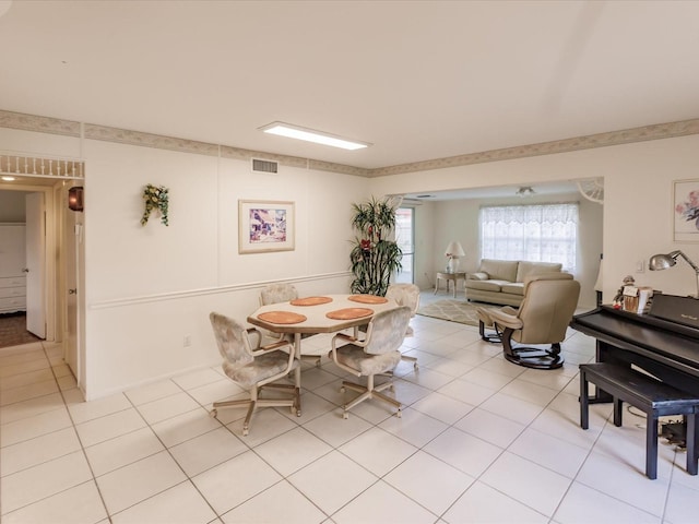 dining area with light tile patterned floors