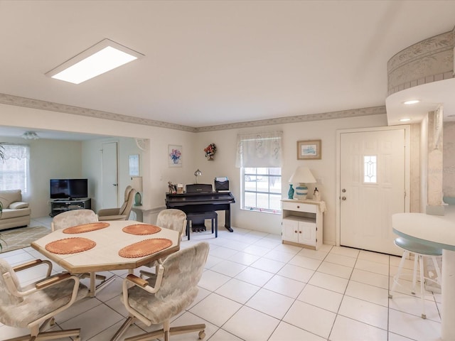 tiled dining area with a healthy amount of sunlight