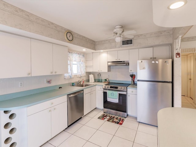 kitchen with white cabinets, sink, ceiling fan, and stainless steel appliances