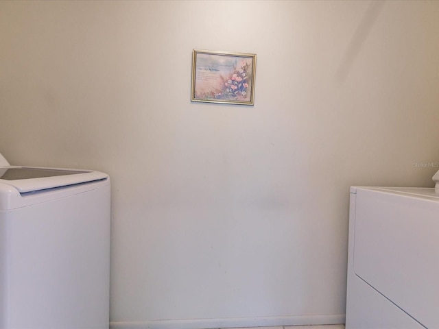 laundry area featuring washing machine and clothes dryer