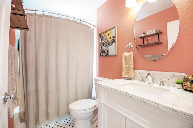 bathroom with toilet, vanity, tile patterned floors, and curtained shower