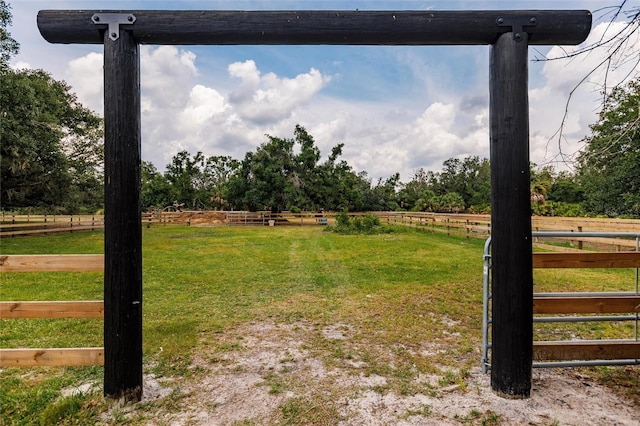 view of yard with a rural view