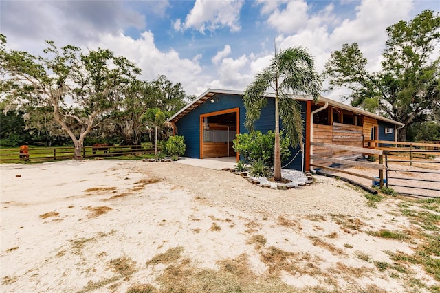 view of side of property with an outbuilding