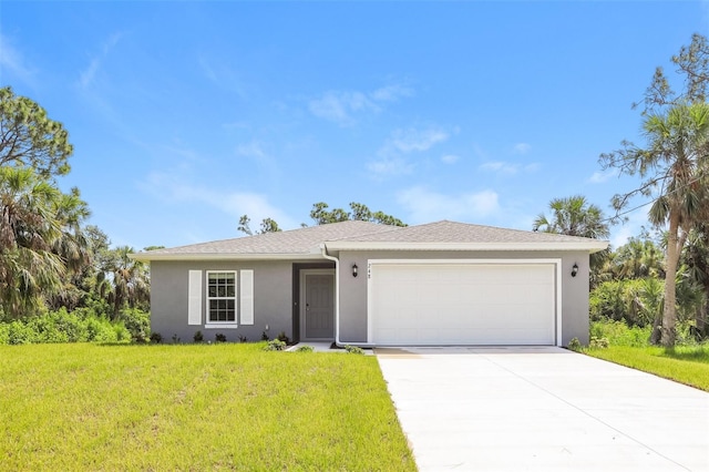 single story home with a garage and a front lawn