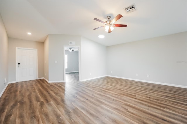 unfurnished living room with dark wood-type flooring, ceiling fan, and lofted ceiling