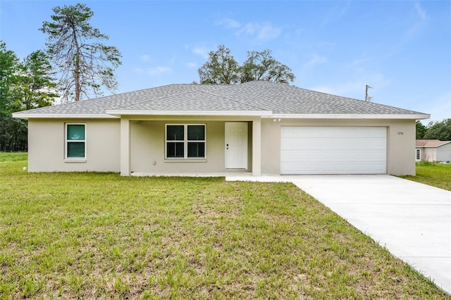 ranch-style home featuring a garage and a front yard